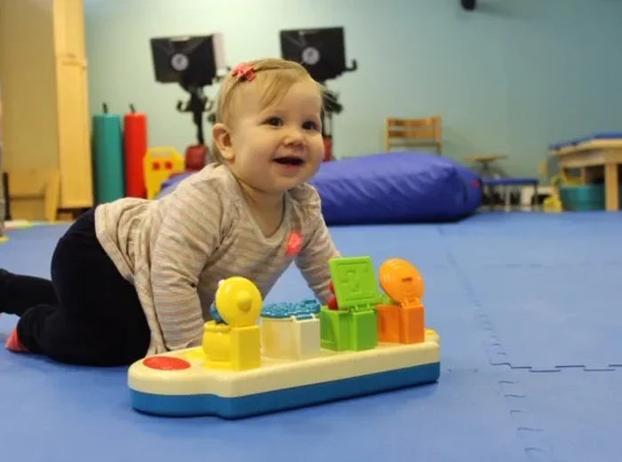 Two children doing a fitness game together in a wellness session