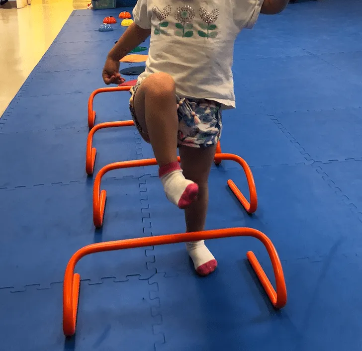Child Walking Over Hurdles